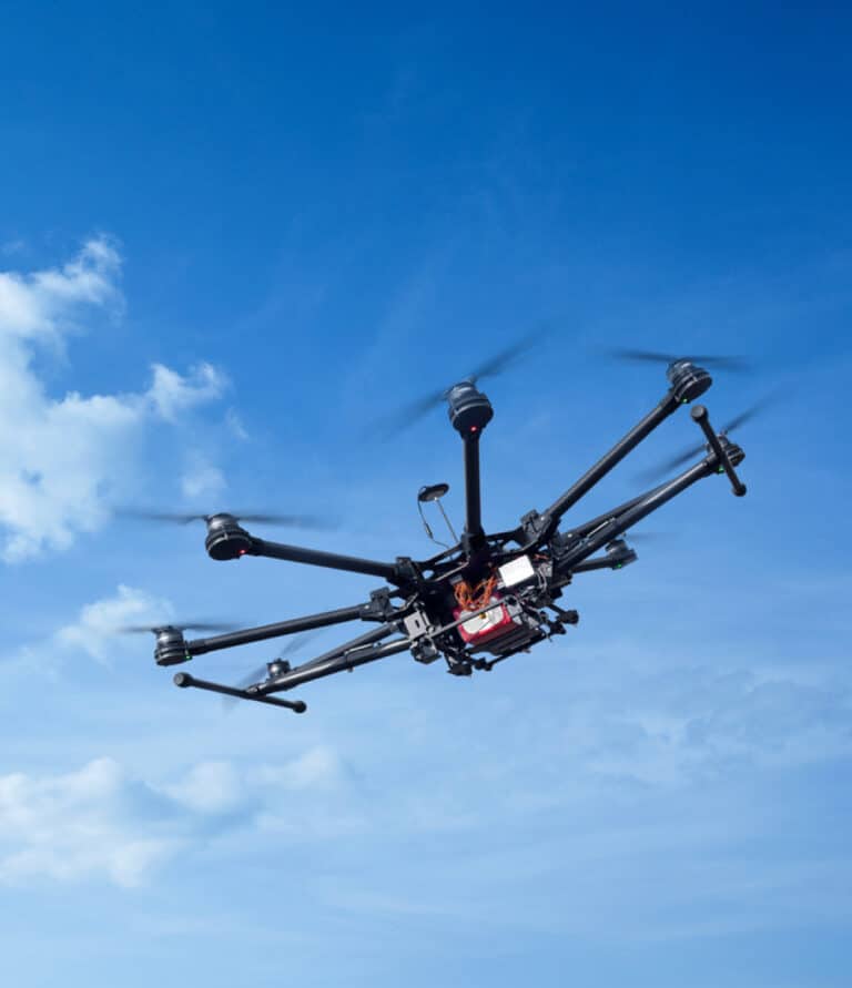 UAV-Drone flying in blue skies.